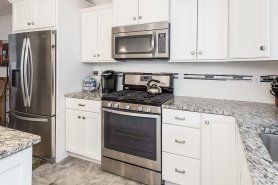 Kitchen with stainless appliances and gorgeous granite