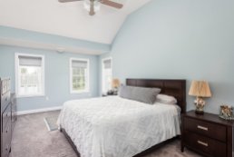 81 Avalon Drive master bedroom in silvery blue with vaulted ceiling